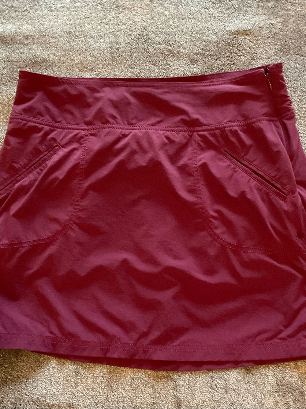 Athleta Burgundy Active Skort with Zip Pockets Side winch Cords Size 10